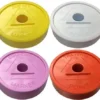 A set of four different colored lids for markers.