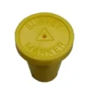 A yellow bottle cap with the words survey marker written on it.