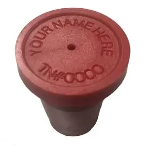 A red bottle cap with the name of a person