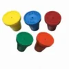 A group of five different colored lids.