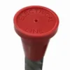A red electrical line marker sitting on top of a white table.